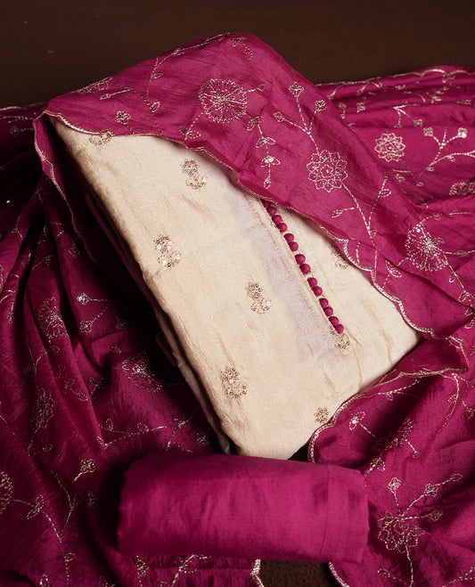 Golden Cream colour churidhar material featuring thread embroidery on the front panel, contrast maganta colour dupatta with elegant border, and matching plain bottom