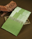 Lime green colour mixed chanderi cotton saree with vertical striped body, pallu featuring rose gold zari border, and matching blouse.