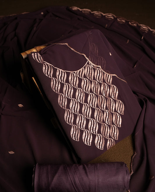 Dark Wine colour churidar material adorned with intricate sequin embroidery on the neckline and body & dupatta comes with embroidered motifs and matching scalloped embroidered border & and plain bottom.