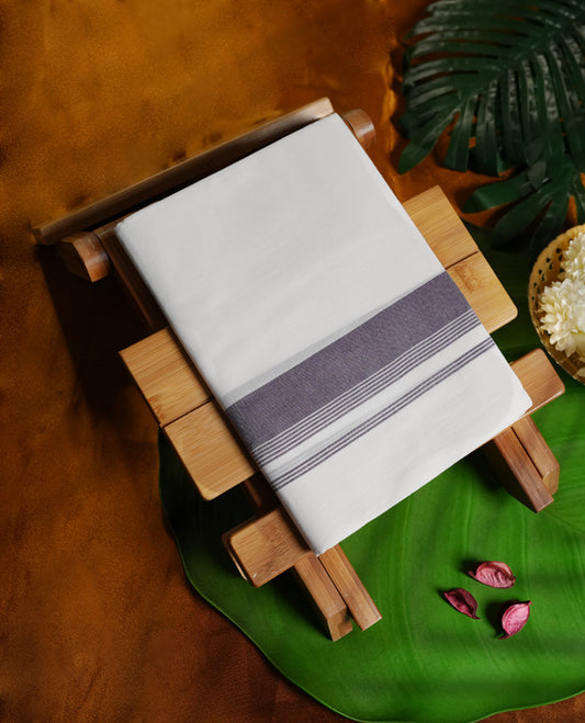 White colour cotton dhoti with a broad ink blue border for a refined traditional look, Perfect for weddings, cultural ceremonies, and festive occasions, offering both style and comfort.