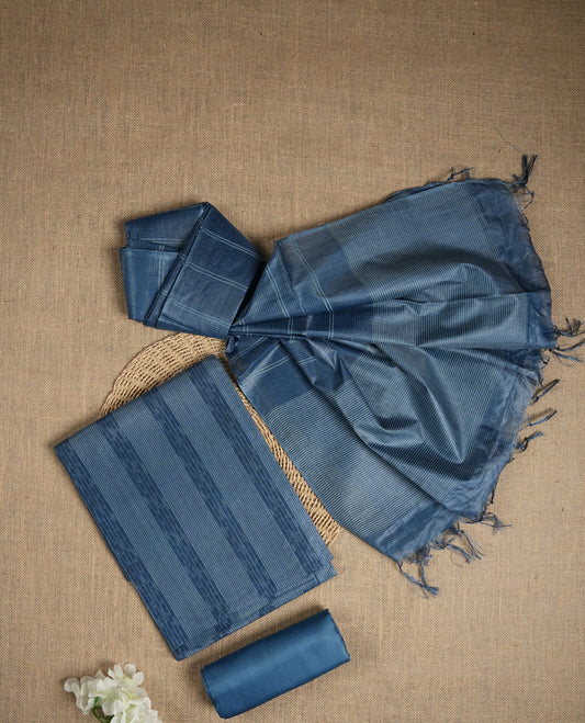 Denim blue colour tussar suit material featuring subtle striped patterns & Includes a soft dupatta with delicate tassels and matching plain fabric for the bottom.