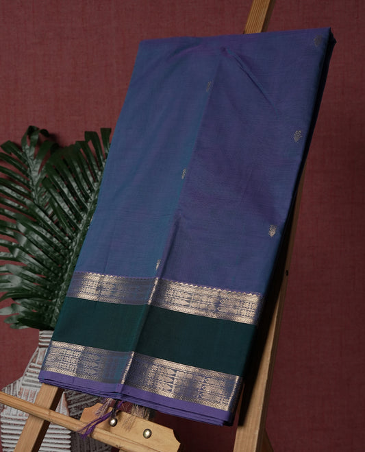 Blue & Purple Double shaded colour pure Kanchi cotton saree with subtle buttas, enhanced by a contrasting green border with rich silver zari wor & Paired with a matching blouse, it offers an elegant and traditional appeal for any occasion.