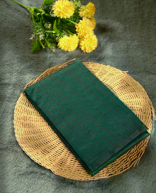 Peacock green colour silk cotton saree featuring with full of delicate vertical copper zari lines on the body & rich black colour pallu, Crafted without a border for a classy touch, Comes with a matching blouse for a perfectly coordinated look.