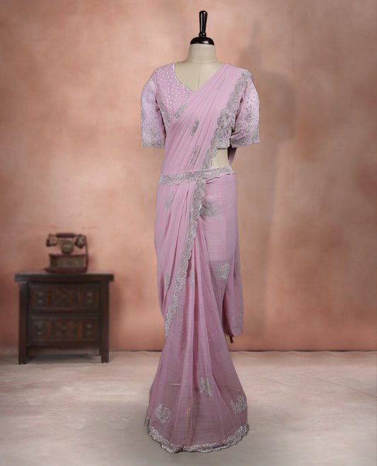 Elegant Baby Pink Colour ready to wear saree adorned with rich silver zari and bead embroidery along the border and pallu, paired with a heavily embellished matching blouse for a grand festive look.