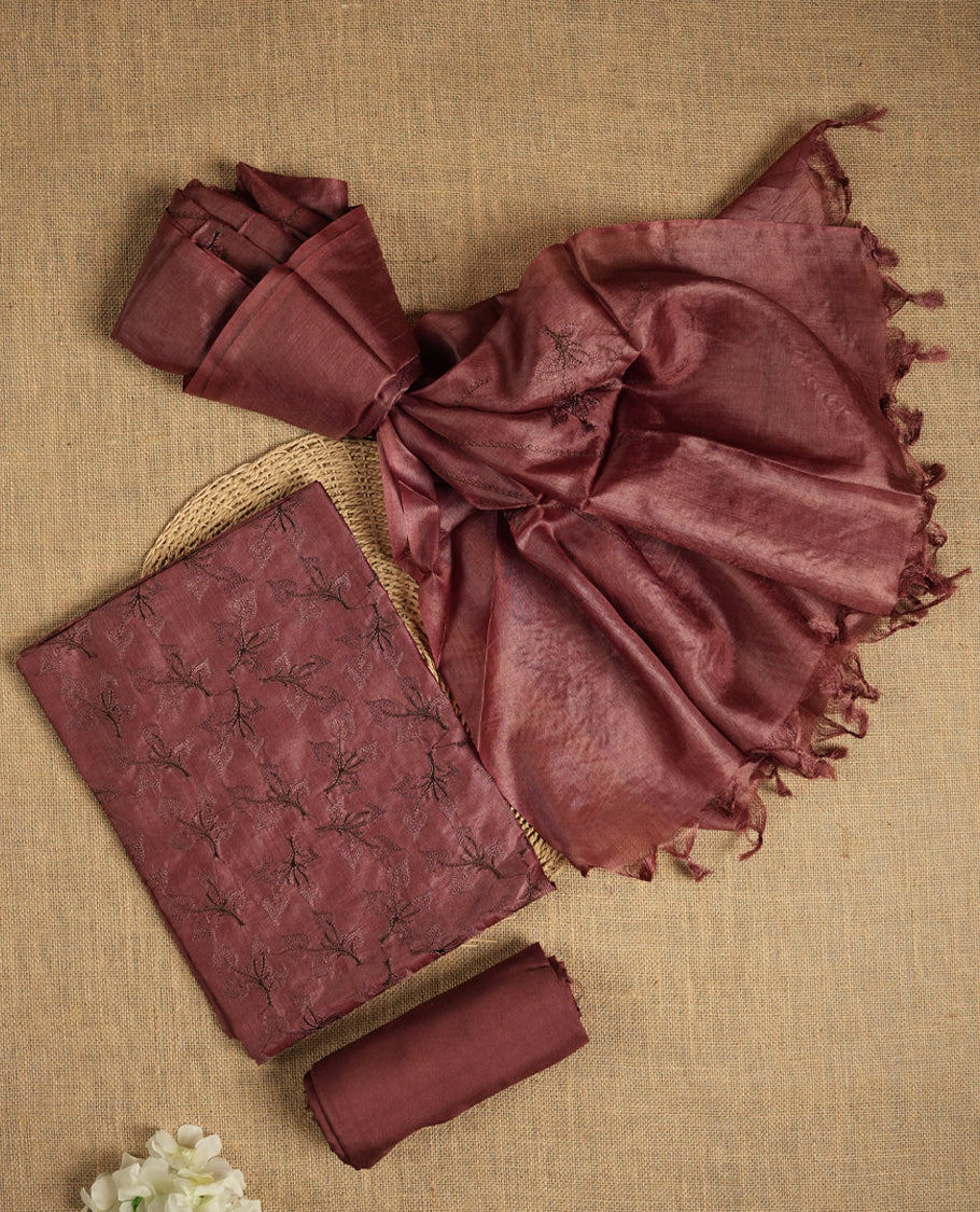 Chocolate brown colour tussar suit material adorned with intricate elegant embroidery work, exuding ethnic elegance & Paired with a beautifully embroidery dupatta and a matching plain bottom.