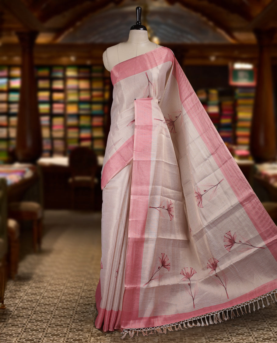 Beige colour Semi tissue saree adorned with Pink toned digital Floral prints on the body and an elegant pallu & comes with a matching blouse piece