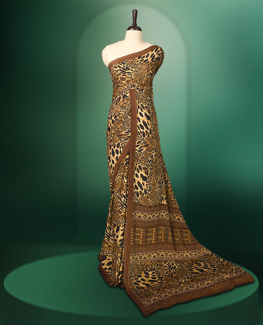 Brown colour semi modal silk saree with a striking leopard print across the body, complemented by a deep brown plain border, and paired with a matching blouse