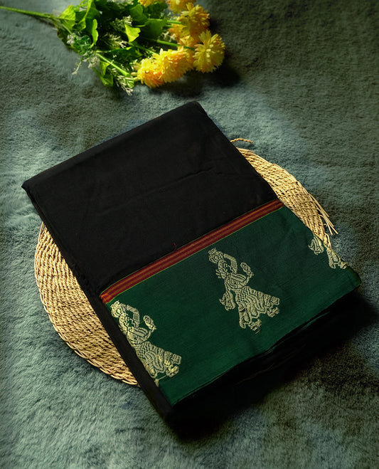 Black colour Narayanapattu cotton saree with a plain black body, green pallu adorned with traditional dancer motifs in thread work, and a maroon striped border & A cultural classic, this saree comes without a blouse piece.