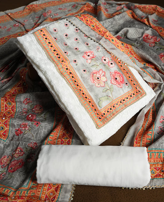 White colour churidhar material featuring Mirror and thread embroidery & foral print pattern on the contrast ash colour front panel, floral digital printed dupatta with elegant border, and matching plain bottom