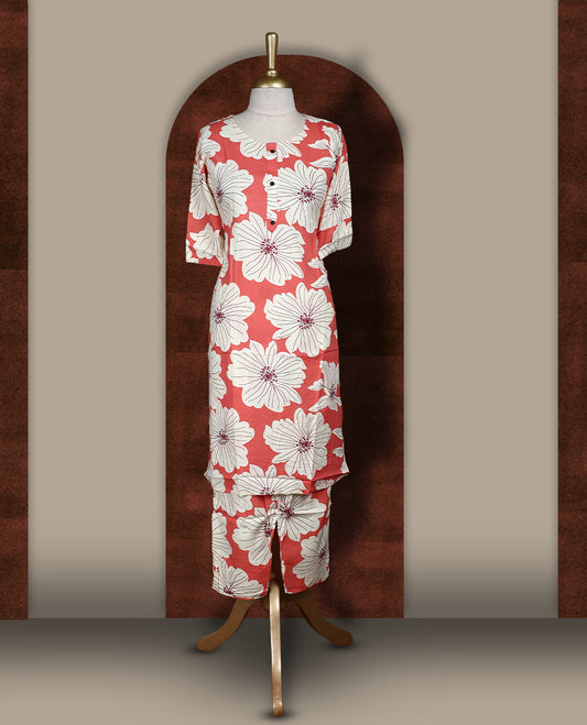Soft Peach colour coord set adorned with all over off white colour floral prints, featuring a straight cut kurta with round neckline and 3/4th sleeves, paired with matching bottoms.