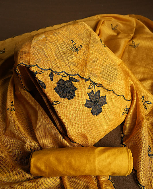 Yellow colour churidhar material featuring Black colour thread embroidery on the front panel, self colour dupatta with elegant border, and matching plain bottom