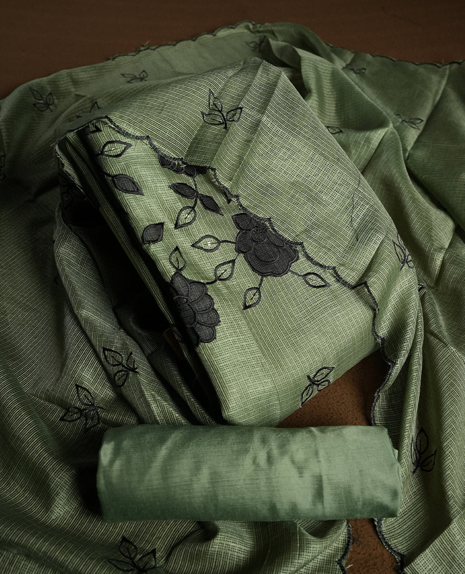 Olive colour churidhar material featuring Black colour thread embroidery on the front panel, self colour dupatta with elegant border, and matching plain bottom