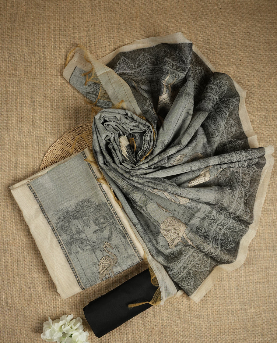 Beige & Black colour suit material adorned with intricate woven patterns, bird print & subtle motifs, exuding ethnic grace & paired with a beautifully bordered dupatta and a matching plain bottom.