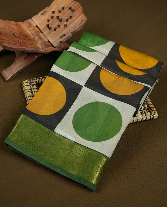 Multicolor mixed chanderi cotton saree with mustard-yellow and green circles on black and off-white checkerboard squares, green and golden zari pallu with polka dots and floral motifs, and matching green blouse.