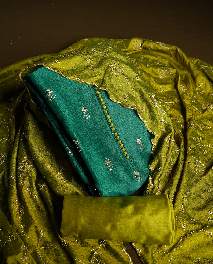 Green colour churidhar material featuring thread embroidery on the front panel, contrast Olive colour dupatta with elegant border, and matching plain bottom