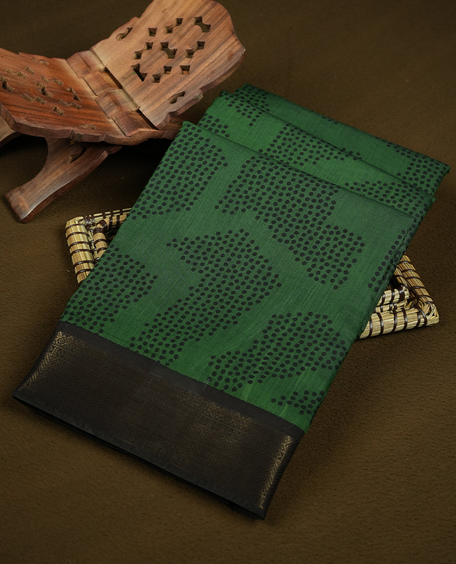 Green colour mixed chanderi cotton saree with black dotted square motifs, black and golden zari border with triangle geometric pattern, striped pallu, and matching green blouse