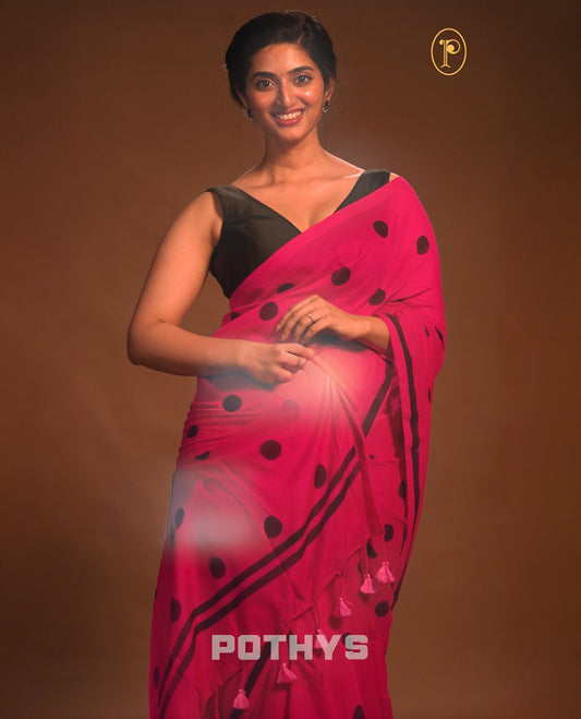 Pink colour Mul cotton saree featuring polka dot prints across the body, accented with a subtle small border, without a blouse piece.