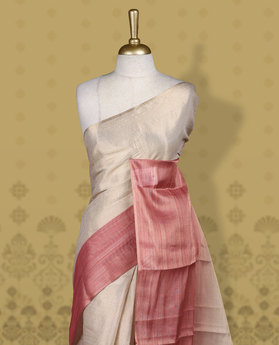 Beige and rose pink colour saree featuring a soft woven texture & The shaded pink pallu enhances its elegant drape & Finished with neat tassels and paired with a matching blouse piece.