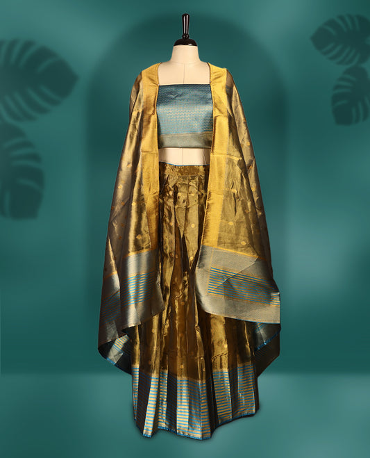 Graceful semi stitched dhavani set in golden mustard and dark aqua blue, crafted in silk with rich zari work & Perfect for festive occasions, weddings, and traditional events, Customizable for a perfect fit.