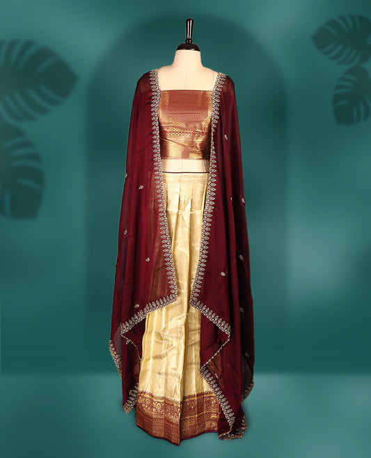 Graceful semi stitched Dhavani set featuring a deep maroon embroidered dupatta, golden zari lehenga, and matching blouse & Perfect for weddings, festivals, and traditional celebrations.