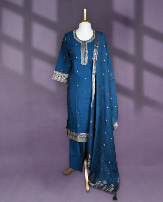 Teal blue colour salwar set with round neck and elbow sleeves featuring mirror embroidered neck sleeve and hemline with scattered buttis on body paired with matching plain bottom and embroidered dupatta