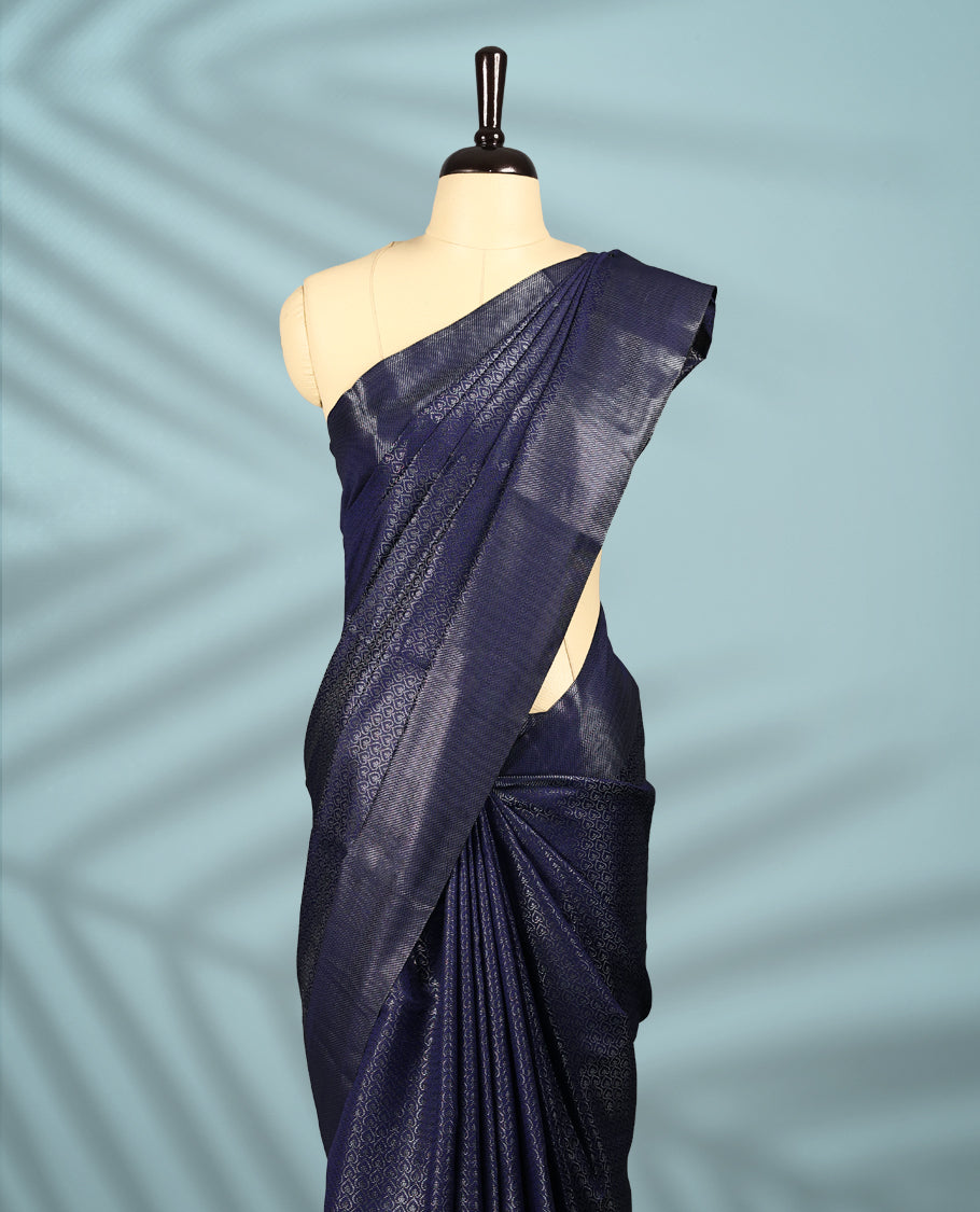 Navy Blue Colour semi silk saree featuring an intricate Zari  motif weave across the body, paired with a zari worked border with matching blouse.