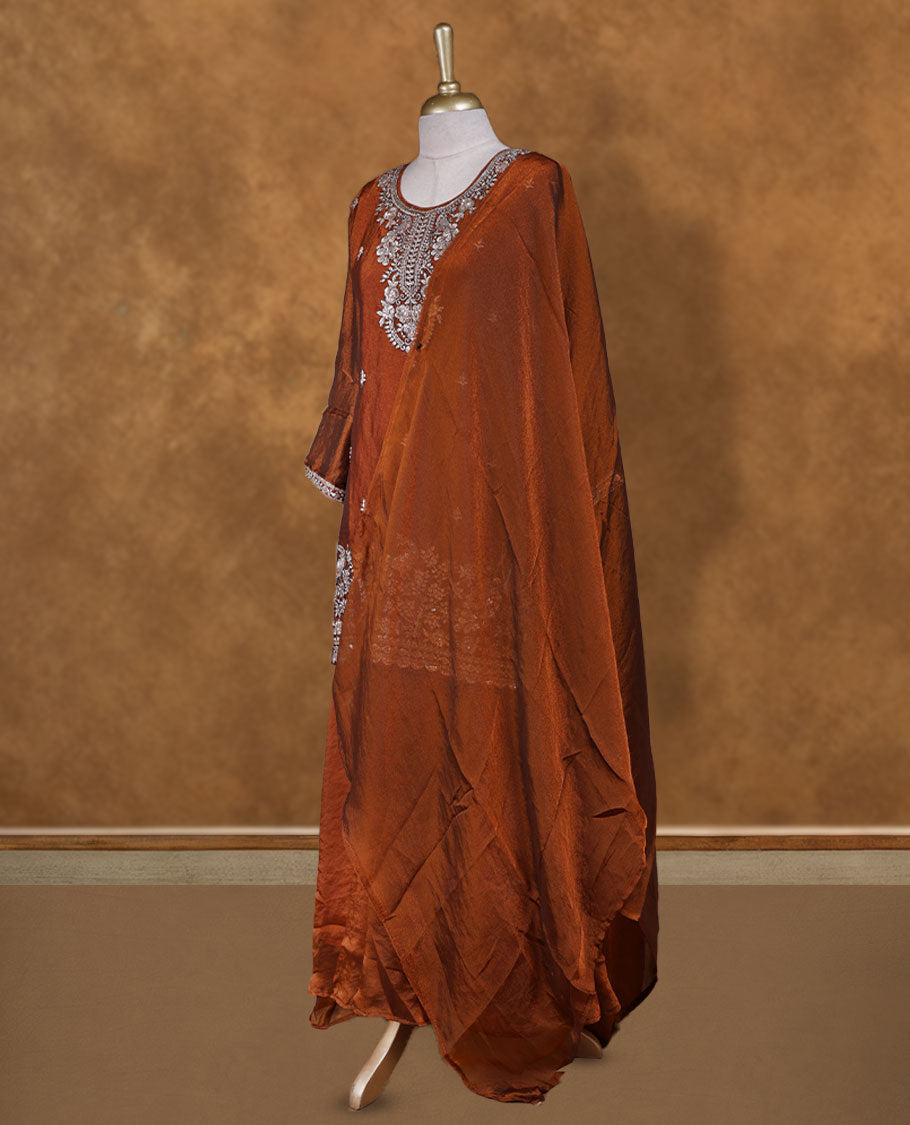 Brown colour sharara set adorned with intricate silver embroidery and sequins work & The fitted embellished top pairs beautifully with the flared bottoms and matching dupatta.