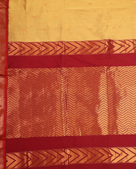 Mustard Yellow and Maroon Kalyani cotton saree featuring subtle woven motifs on the body, complemented by bold zig-zag patterned zari border and pallu, paired with a matching blouse.