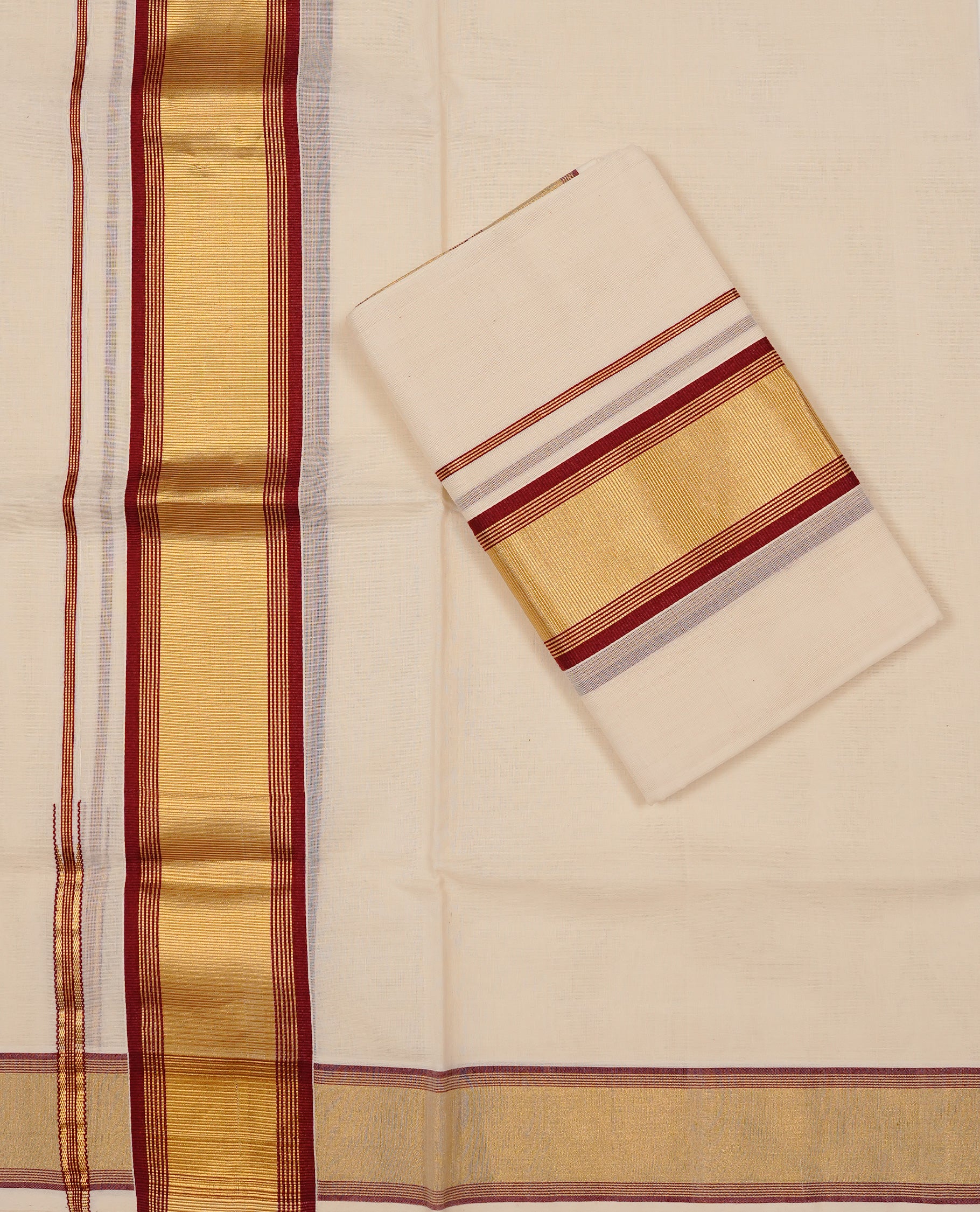 Off white colour Cotton Set Mund featuring a plain body, enhanced by a gold zari border with Maroon stripes.