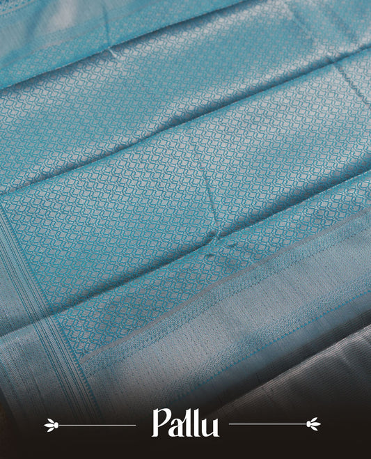 Aqua blue colour semi silk saree featuring neem zari Brocade Pattern all over the body, complemented by a Self Colour woven border with detailing, Pallu & blouse.