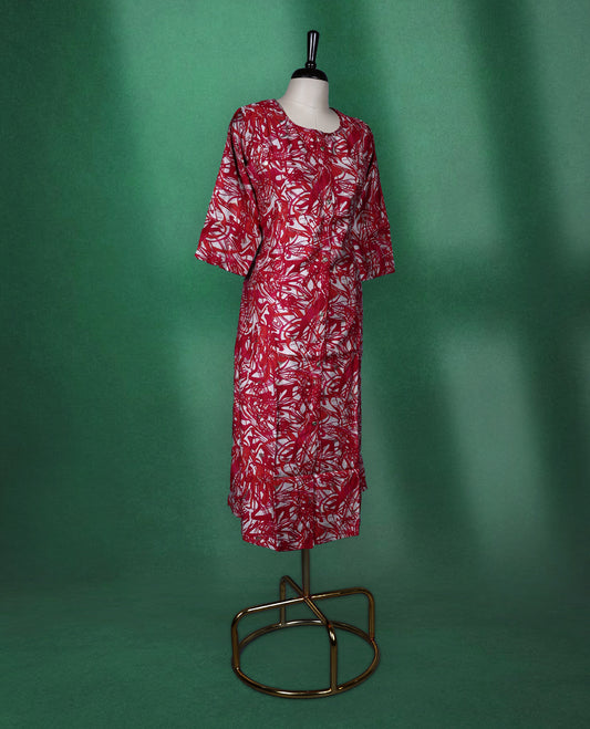 Magenta, red and white printed kurti with all over abstract patterns, featuring a round neckline, front button placket, and elbow length sleeves ideal for a bold and breezy casual look.