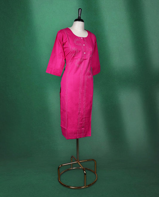 Magenta pink colour cotton kurti featuring delicate embroidery on the front, a round neckline with button detailing, and elbow length sleeves, vibrant and elegant pick for daily wear.