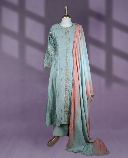 Pastel green colour salwar set showcases a keyhole neckline and three quarter sleeves adorned with intricate sequin embroidery, paired beautifully with a dual tone dupatta