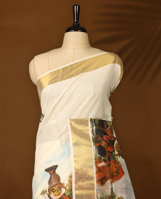 Elegant off white Kerala cotton saree featuring Kerala’s traditional cultural and scenic digital prints, beautifully enhanced with a classic golden zari border paired with a matching blouse.
