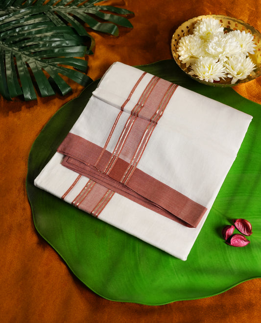 Off white colour cotton dhoti adorned with a rich rust brown kara and fine gold accents & crafted for heritage elegance and everyday ease, perfect for rituals, festive gatherings, and cultural events.