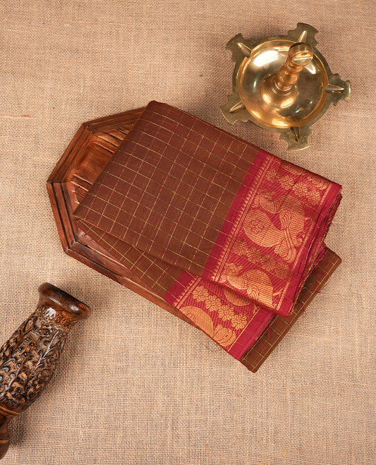 Olive brown colour sungudi cotton saree featuring gold zari check pattern across body, contrast Maroon colour with gold zari peacock and floral pattern on border, without blouse piece.