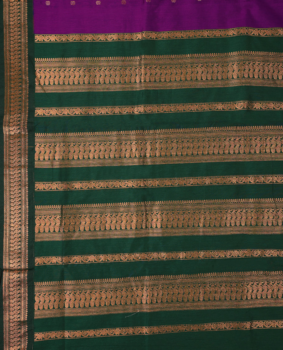 Purple colour mixed Kalyani cotton saree featuring Copper zari motifs throughout the body, paired with Bottle Green colour traditional border and pallu, with matching blouse