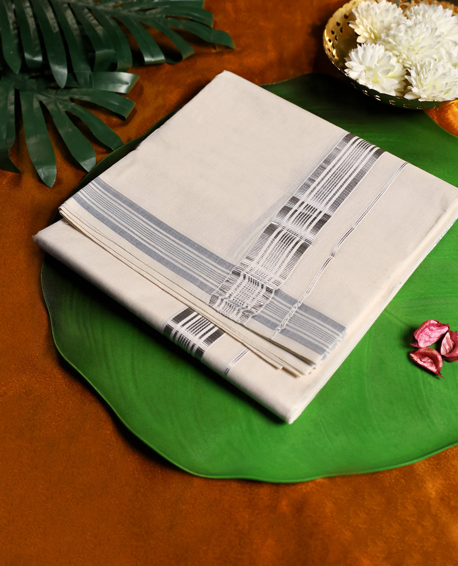 Classic off white colour cotton dhoti adorned with a sleek silver zari border featuring subtle striped detailing, combining comfort and elegance, perfect for traditional functions and festive wear.