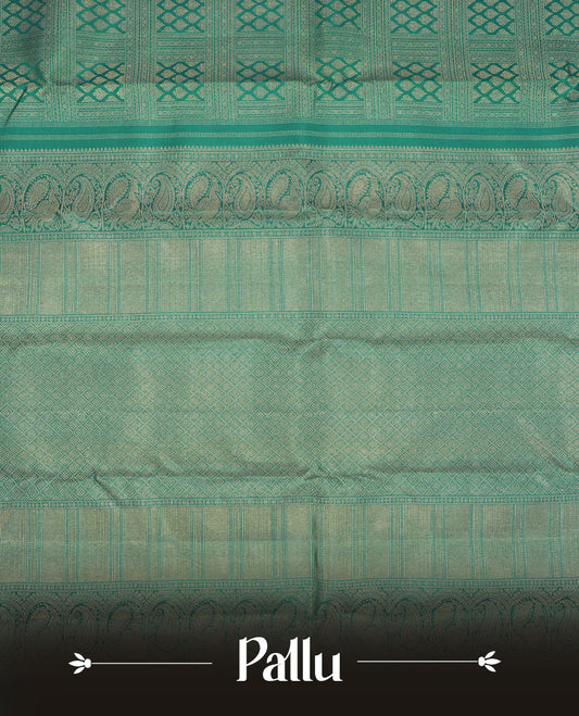 Turquoise blue colour Kanchipuram pattern Manthrakodi saree featuring golden zari box jacquard with small zari motifs across the body, traditional zari border, zigzag bavanji detailing, and plain zari blouse piece.