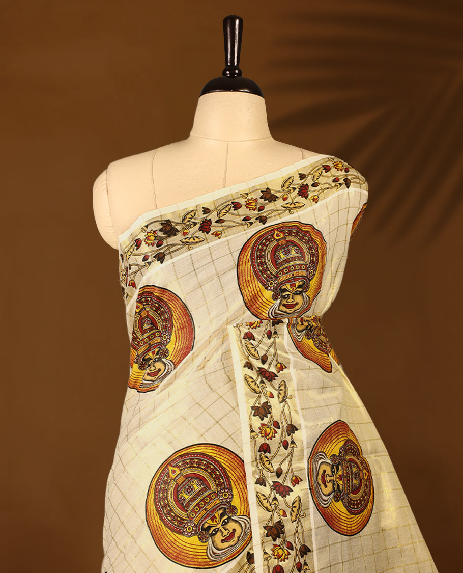 Light Gold colour Tissue Kerala saree featuring Kathakali motifs on the body, golden zari checks, and a beautifully woven border with Floral Printed motifs, paired with a matching blouse perfect for festive occasions.