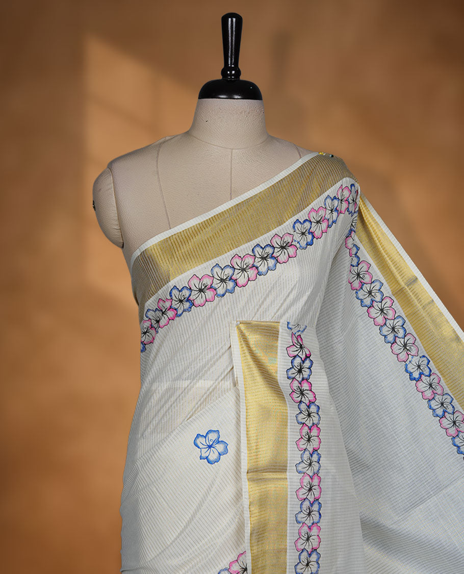 Off-white colour kerala saree featuring pink and purple colour floral border detailing with gold kasavu accents, complemented by a matching blouse piece.