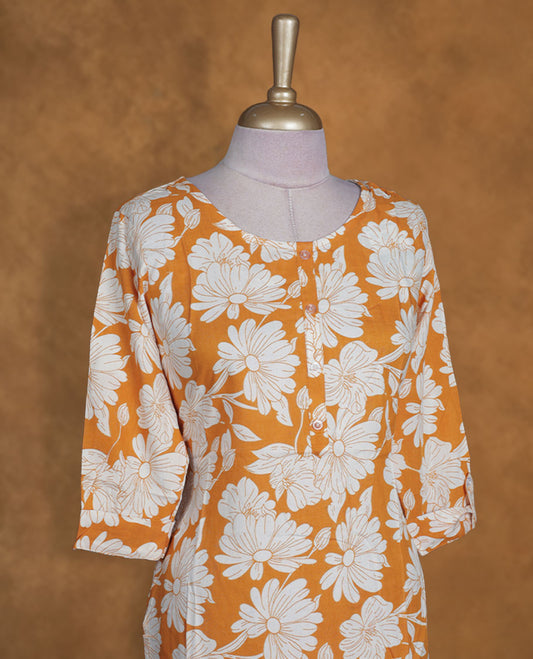 Mustard and white colour kurti with White floral prints, knee length design, styled with a round neckline and a sleeve