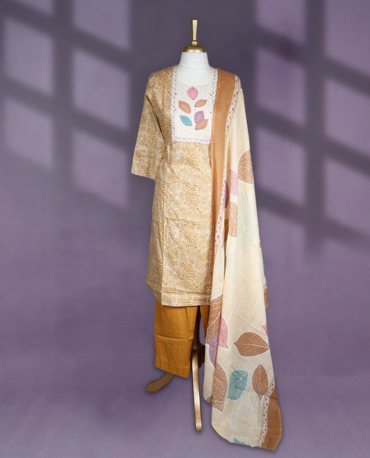 Mustard and beige colour salwar set with round neck and elbow sleeves features leaf printed yoke and all over line floral design paired with matching plain bottom and multicolour leaf print dupatta