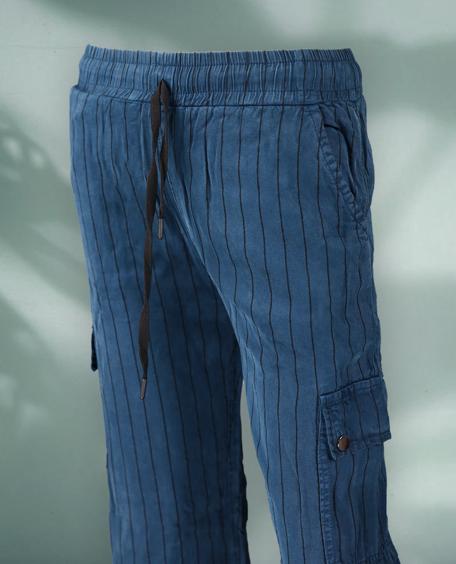 Blue colour pinstriped cargo pants featuring a relaxed fit with an elastic waistband and drawstring tie, crafted from soft, breathable fabric