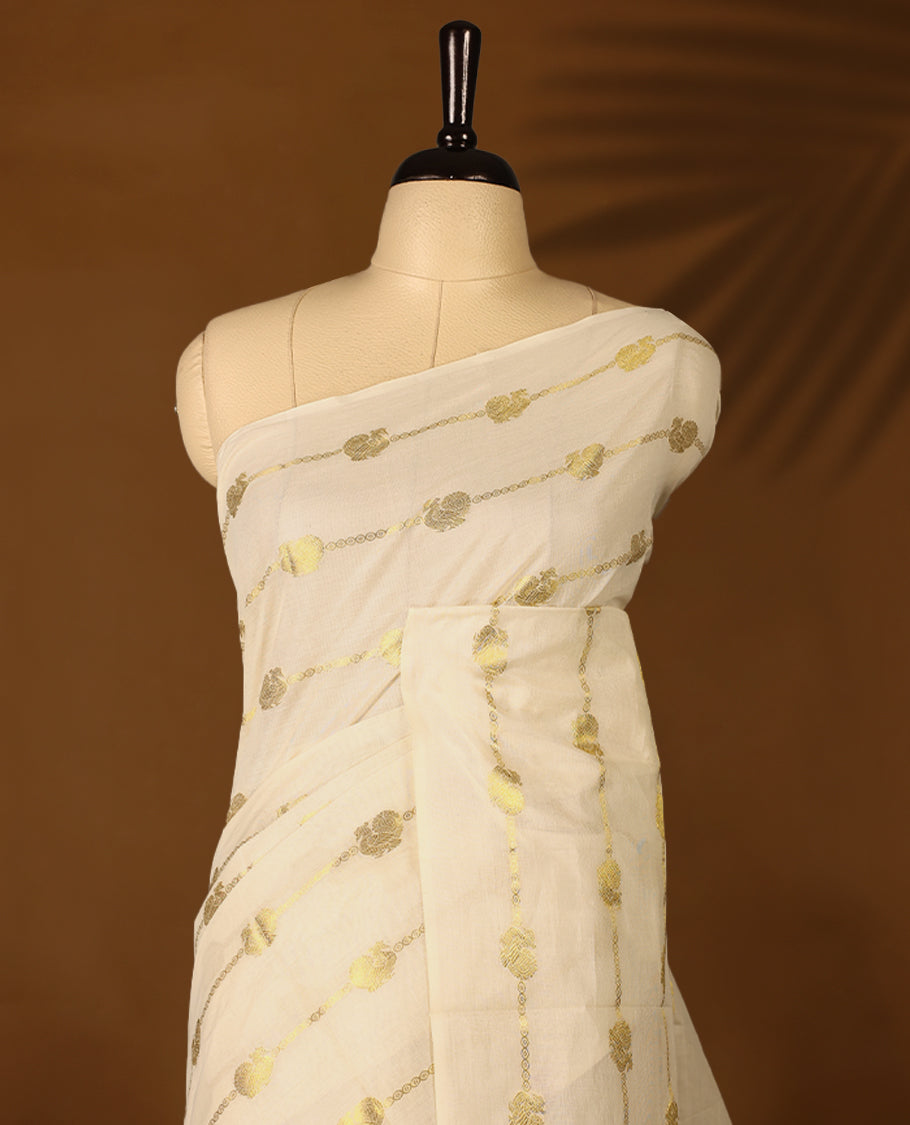 Light Gold colour Cotton Kerala saree featuring gold zari Stripes with peacock motifs on body, without border, paired with a matching blouse perfect for festive occasions.