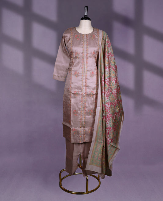 Taupe colour kurti set features a round neckline and 3/4th sleeves, adorned with vertical thread embroidery and floral motifs, beautifully complemented by self colour Bottom & a richly woven multicolor dupatta.