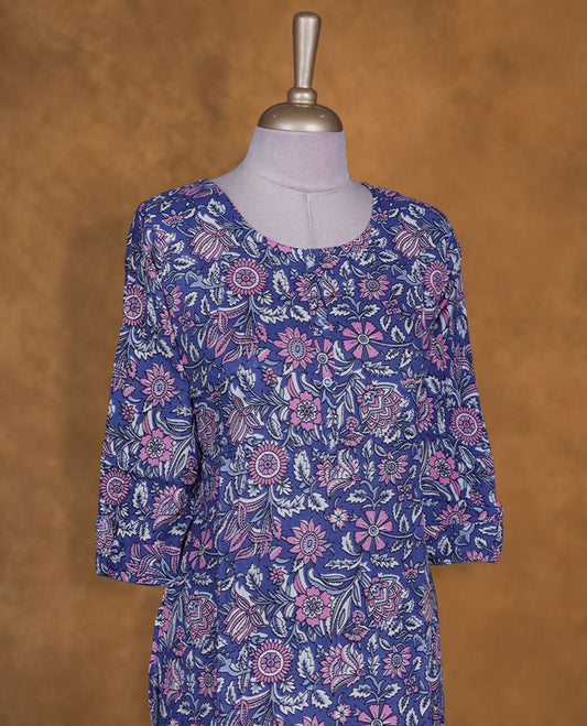 Blueish violet colour kurti with White & pink floral prints, knee length design, styled with a round neckline and a sleeve .