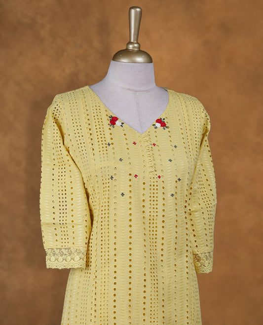 Yellow colour kurti with self colour colour thread pattern across the body, knee length design, styled with a V neckline and a  sleeve .