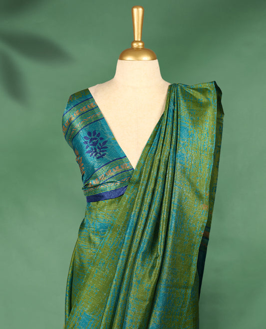 Olive green colour Manipuri saree with subtle blue textured patterns, minimal border, and comes with a matching blouse.
