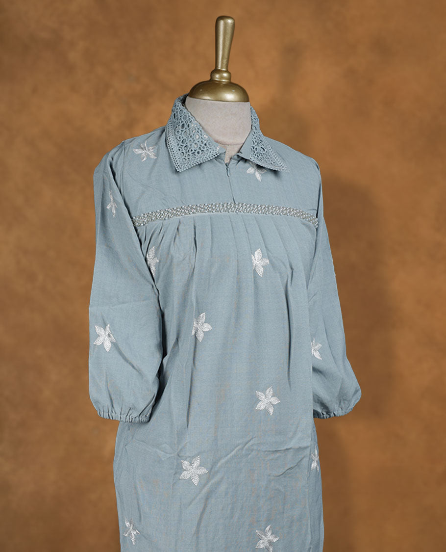 Dusty blue embroidered nightwear kurti with white floral thread work, crochet-detailed shirt collar, front yoke gathers, and three-quarter sleeves with elasticated hem.